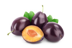 fresh purple plum and half with leaves isolated on white background with clipping path and full depth of field