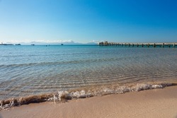 Alcudia beach, in Mallorca.Crystal clear and turquoise waters in a large sandy area with a boardwalk.