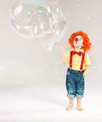 Little clown and bubble soap