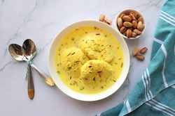 Rasmalai, Rossomalai, Roshmolai, Rasamalei is a very popular Indian dessert. It's a Similar dish to Rasgulla. It is a sweet delicacy made with Indian cottage cheese or chenna. Copy space.