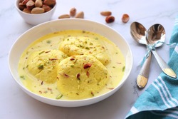 Rasmalai, Rossomalai, Roshmolai, Rasamalei is a very popular Indian dessert. It's a Similar dish to Rasgulla. It is a sweet delicacy made with Indian cottage cheese or chenna. Copy space.