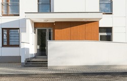 Detail for an entrance in a modern multifamily building in a European city. 