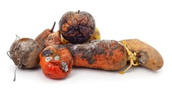 Heap of rotten vegetables and fruits isolated on a white background.