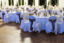 an image of tables setting at a luxury wedding hall