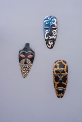 Tree black tribal mask on wall from africa