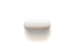 White pill tablet isolated on white background with clipping path and copy space. Paracetamol is painkiller for primary treatment such as headache. Drug and medical concept.