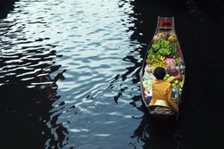 Seller on boat , floating market ,Thailand