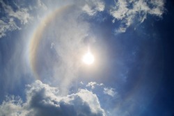 Halo against the Blue sky and clouds.