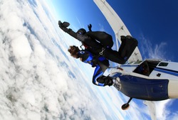 Skydiving tandem jumping from the plane