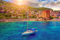 White yacht in the sea bay. Harbor of the Red Tower Alanya, Turkey. Holidays at sea. The coast of Turkey.