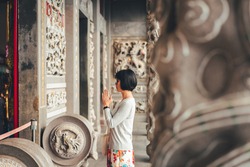 traveling woman praying at Wenwu temple, Taiwan