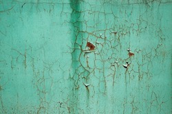 Turquoise (blue, green) texture of cracked, weathered paint on an old rusty metal plate. Close-up. Space for text, background for design.