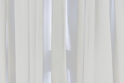 
white translucent window blinds
Classic lighting concept, white background hanging by the window in the room.