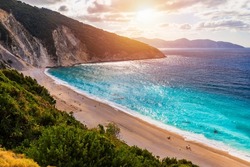 Aerial drone view of iconic turquoise and sapphire bay and beach of Myrtos, Kefalonia (Cephalonia) island, Ionian, Greece. Myrtos beach, Kefalonia island, Greece. Beautiful view of Myrtos beach.