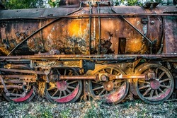 Side view of a rusty train abandoned