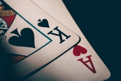 Two cards king of spades and ace of hearts. Ace and king poker cards. Nuts hand to win. Luck in the game of blackjack. High quality photo