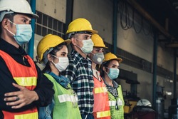 Factory workers with face mask protect from outbreak of Corona Virus Disease 2019 or COVID-19.