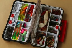 Fisherman's box full of different tuckes, baits, hooks, plugs and lures