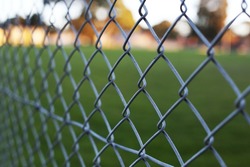 Chain link fence, steel metal industrial pattern in court, selective focus