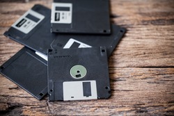  floppy disks on a wooden table
