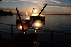 sunset coctail at lake of constance. during summertime at bodensee the drinks taste even better with a warm breeze in the afternoon and sunset.