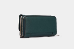 Side view on Emerald green women's Wallet Purse clutch. Leather Pouch for women ladies with zipper isolated on white background