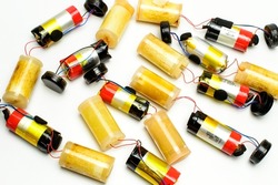 A group of internal parts from a disposable electronic cigarettes. Lithium batteries and vaporizers. White background.