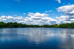 Lake view in the park, blue sky and clouds