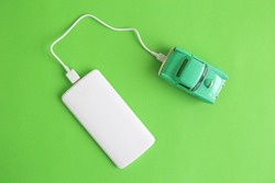 EV or electric car charging with power bank minimal creative concept.