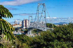 Sunny day view of the Hercilio Luz suspension bridge. The longest suspension bridge in Brazil and the symbol of the city of Florianopolis. Design engineering structure bridge. Bridge structures