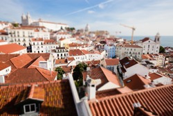 Top view of Lisbon downtown red roof buildings. Artistic miniature tilt shift effect.