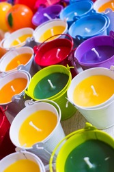 Close up of roma candles with colorful wax. Candle background.