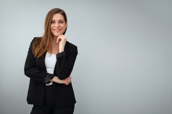 Isolated studio portrait of confident business woman in black suit.