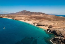 Scenic view of Papagayo Beach and the surrounding volcanic landscape in Costa Blanca, Yaiza, Lanzarote, Canary Islands, Spain