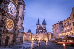 Astronomical clock, Tyn church and old town hall tower in Prague at dawn, Czech republic