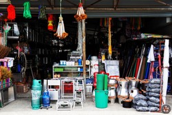 Miscellaneous street shop. Traditional of store front of miscellaneous shops that selling charcoal burning stove, folk fishing tools, and household items for street cart hawkers and houses. Thailand.