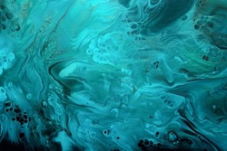 Fluid Art. Turquoise and blue abstract waves with golden particles on black background. Marble effect background or texture
