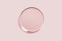 Empty round petri dish or glass slide on pink background. Mockup for cosmetic or scientific product sample