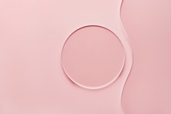 Empty round petri dish and wavy glass slide on pink background. Mockup for cosmetic or scientific product sample
