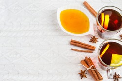 Black tea with lemon, cinnamon and honey. Charming winter background,    with space for text           