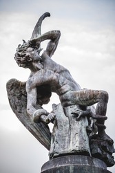 fallen angel, devil figure, bronze sculpture with demonic gargoyles and monsters