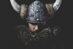 Danger, Viking warrior with iron sword and helmet with horns