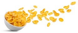 White ceramic bowl of dry uncooked corn flakes. Traditional breakfast yellow cereal in isolated porcelain plate. Falling cornflakes on white background