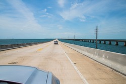 Beautiful endless road from Miami to Key West driving Ford Mustang