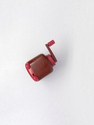  brown rotary pencil sharpener on isolated white background.