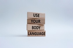 Use your Body Language symbol. Concept words Use your Body Language on wooden blocks. Beautiful white background. Business and Use your Body Language concept. Copy space