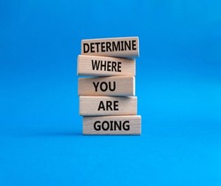 Determination symbol. Wooden blocks with words Determine where you are going. Beautiful blue background. Business and Determine where you are going concept. Copy space