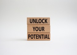 Unlock your Potential symbol. Wooden blocks with words Unlock your Potential. Beautiful white background. Business and Unlock your Potential concept. Copy space.