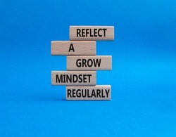 Refclect a grow mindset regularly symbol. Wooden blocks with words Refclect a grow mindset regularly. Beautiful blue background. Business and Refclect a grow mindset regularly concept. Copy space.