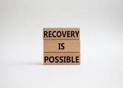 Recovery is possible symbol. Concept words Recovery is possible on wooden blocks. Beautiful white background. Business and Recovery is possible concept. Copy space.